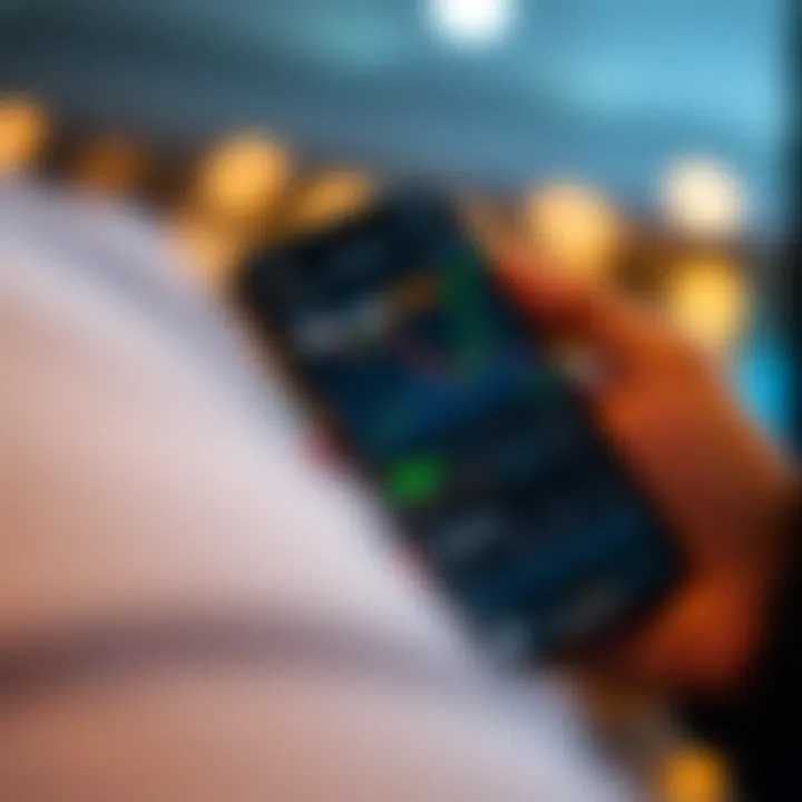 Mobile phone displaying a binary trading application interface with graphs and trading options on screen